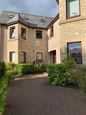Teith court apartment with private parking.